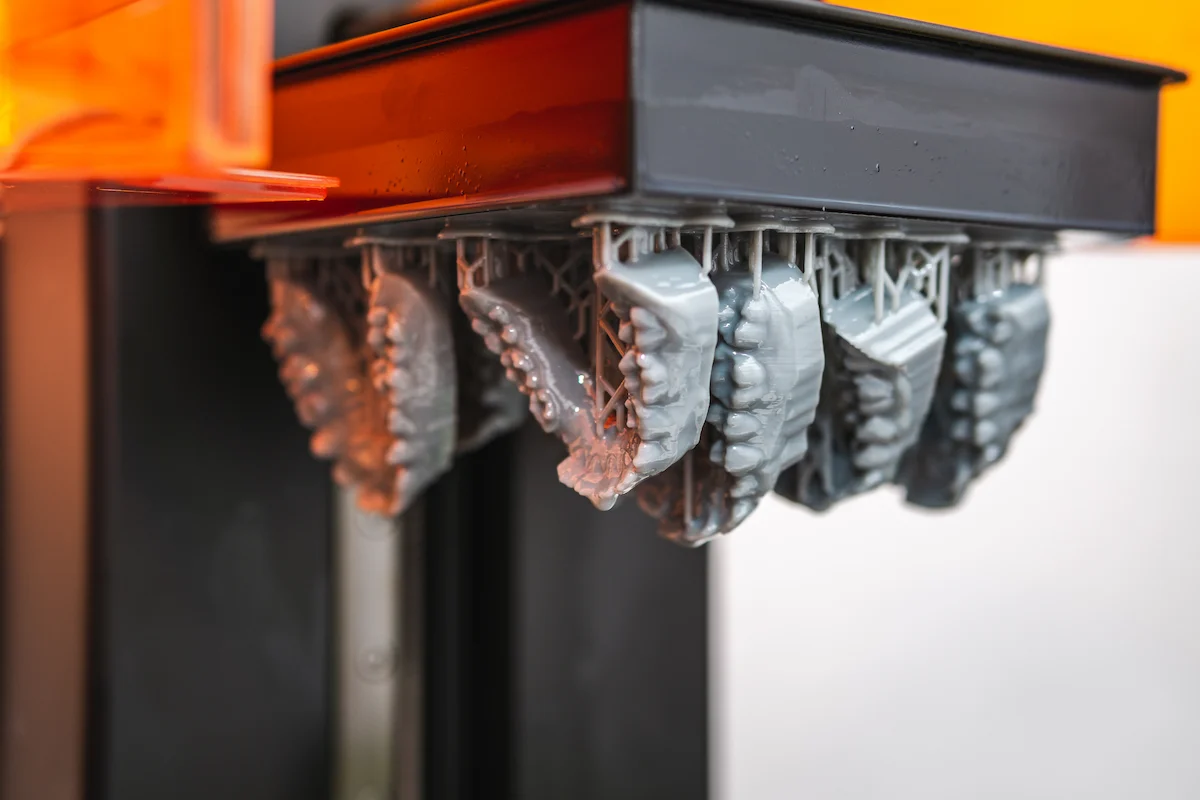 Resin 3D printed dental models on a printer build platform